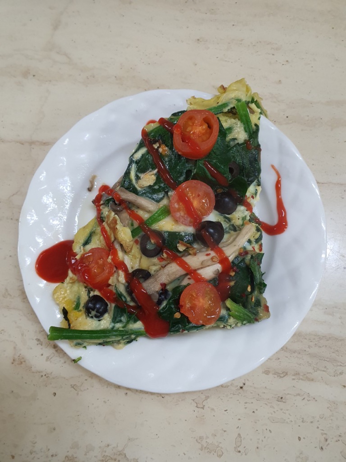 Spinach mushroom omelet wedge with chili sauce