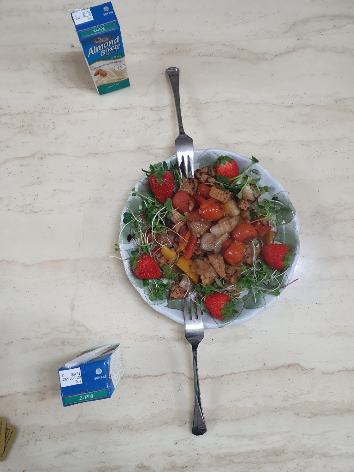 Strawberry salad plate with almond milk